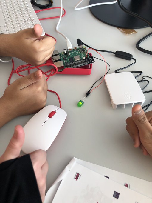 3 hands giving a thumbs up pictured over a Raspberry Pi kit